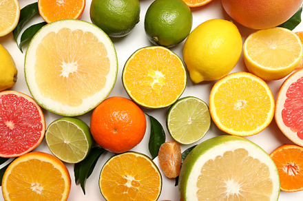 Citrus fruits with leaves on white background, a Food & Drink Photo by AtlasStudio PRO