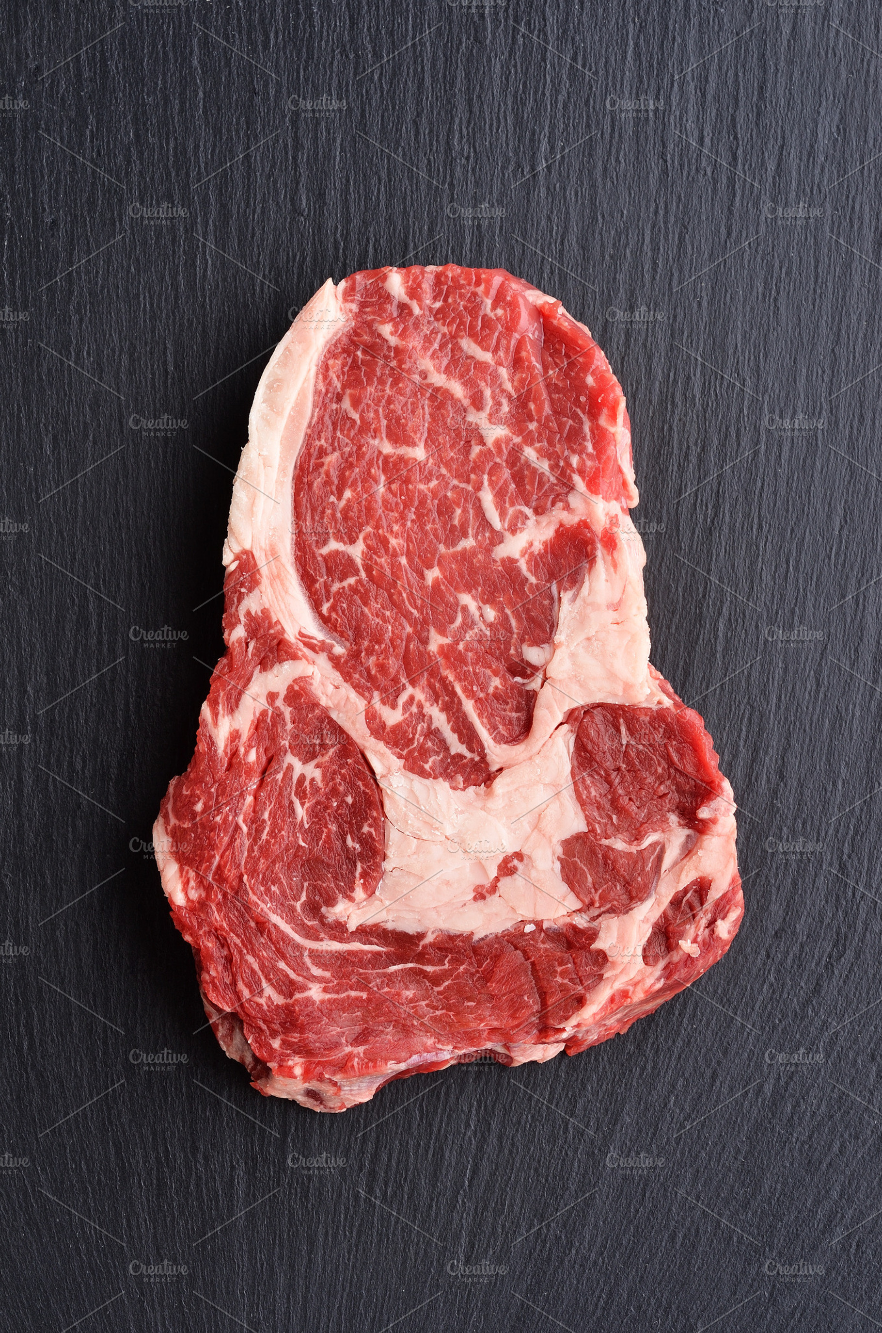 Fresh raw rib eye beef steak featuring beef, prime, and black angus, a Food & Drink Photo by Food Stock