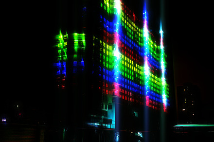 Illuminated building in RGB lights architecture backdrop