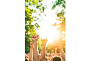 Raised Fists of Protesters Against, a Person Photo by Lermont51
