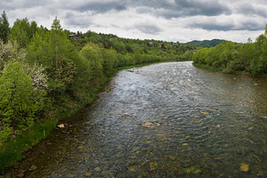 Spring picturesque river band view. Mountains scenery view behin