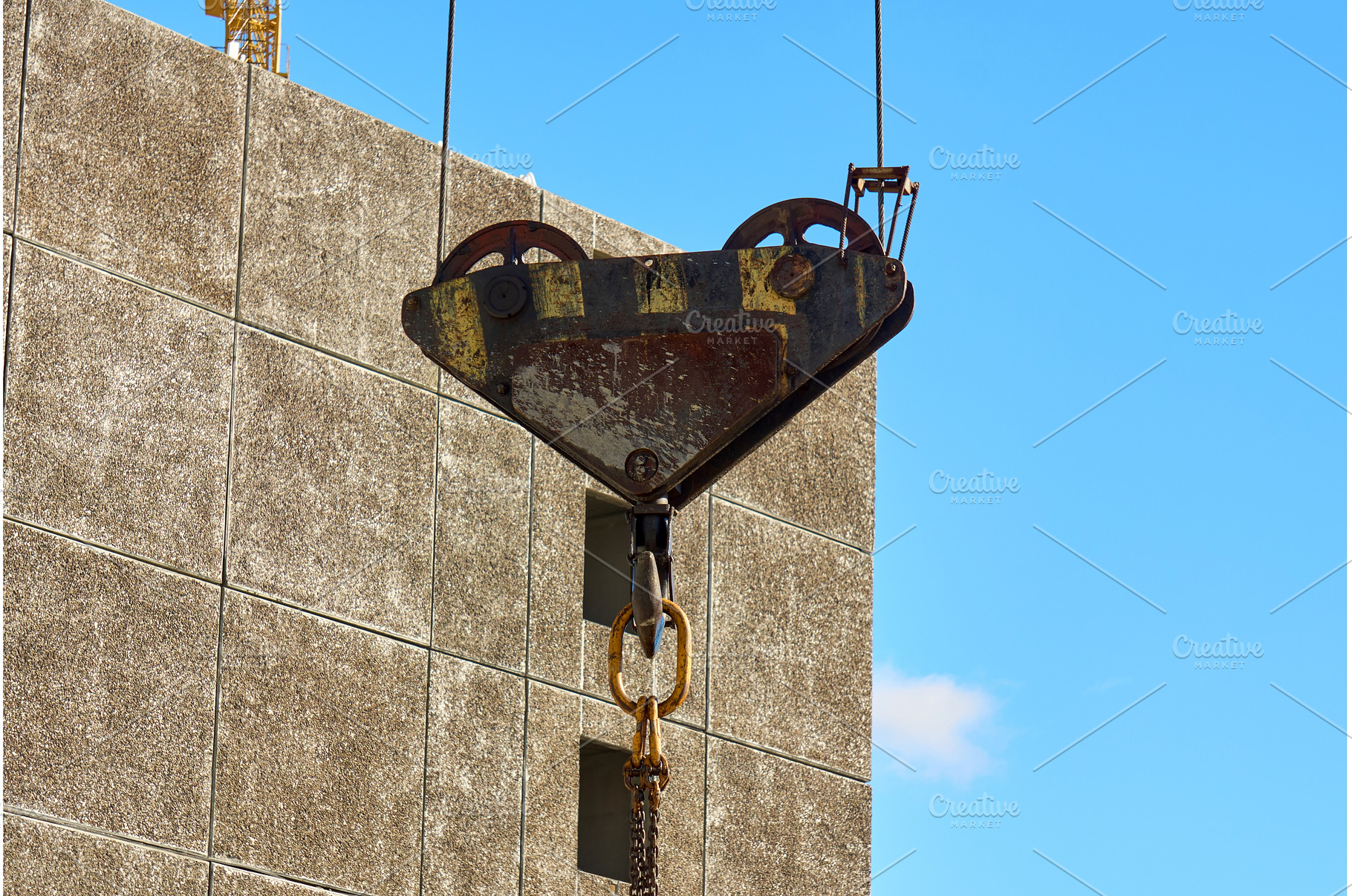 Heavy crane hook hangs from cable, an Industrial Photo by darksoul72