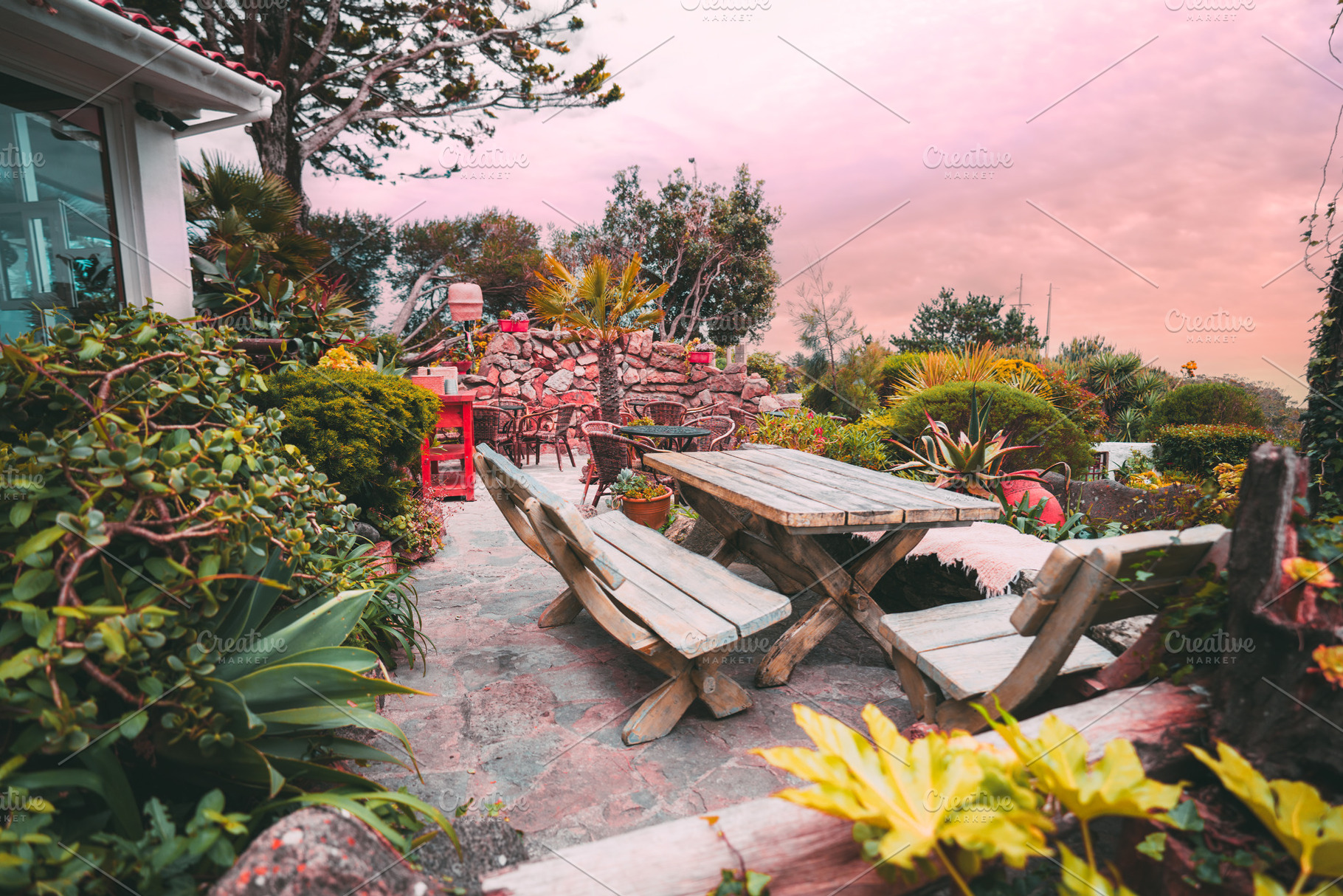 Rustic patio with lush greenery, a Sports & Recreation Photo by SkyNext
