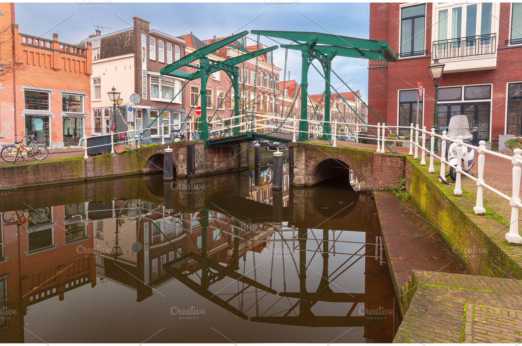 Drawbridge over canal in Leiden, an Architecture Photo by kavalenkava