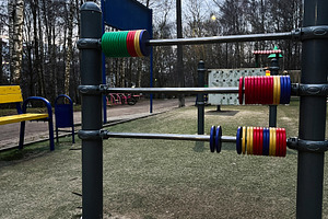 Children outdoor playground with colorful educational equipment during late eve, a Photo by AS photostudio