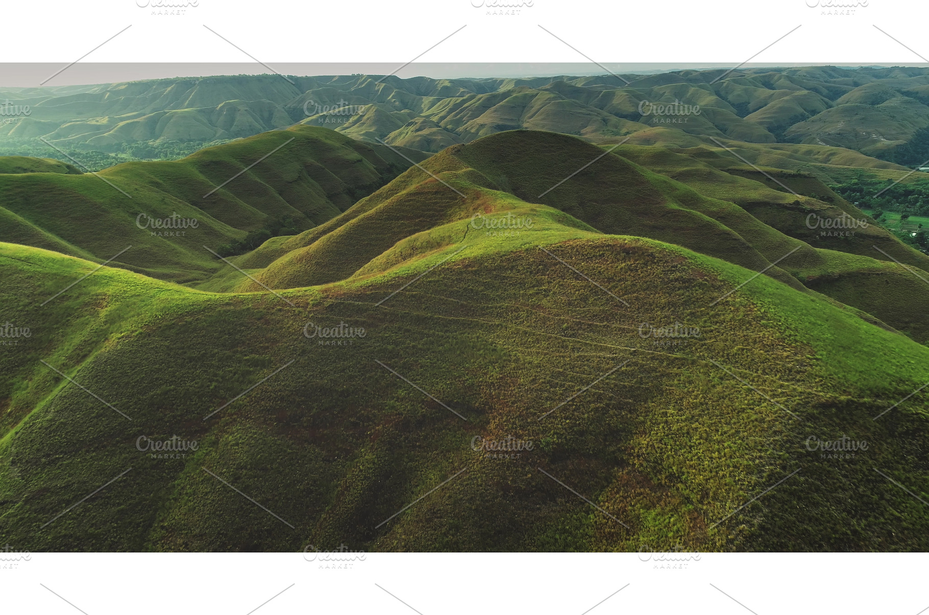 Lush rolling hills covering Sumba, a Nature Photo by Goinyk