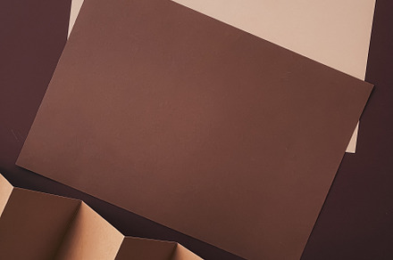 Beige and brown A4 papers as office stationery flatlay, luxury b, a Business Photo by Anneleven