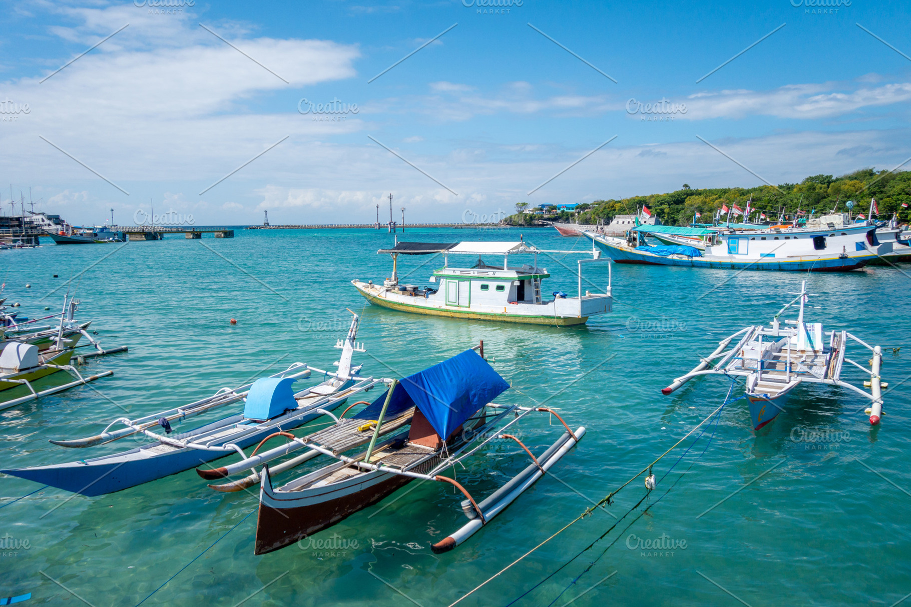 Fishing boats in Bira harbor, Sulawesi, Indonesia on clear day, a Transportation Photo by GoodGoods