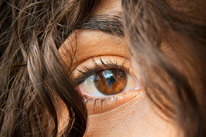 Woman's Eye Through Brown Hair, a Person Photo by THP Creative