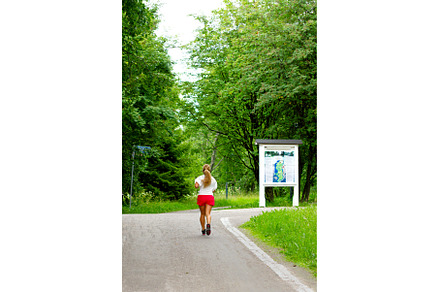 girl jogging in city park