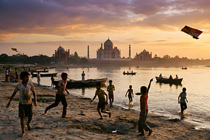 Children playing on the river bank, a Person Photo by nandinigraphics
