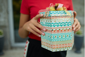 Child holding a wrapped gift outside