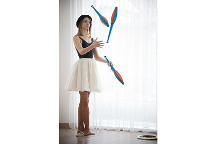 Young woman in a hat juggles in the, a Person Photo by Barcelona_dreams