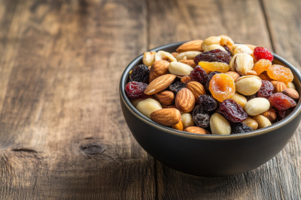 Bowl filled with assorted mixed nuts, a Photo by Pavel_design