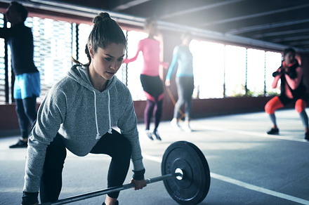 Fit healthy woman lifting a weight barbell stock photo containing active and, a Sports & Recreation Photo by Stefan & Janni