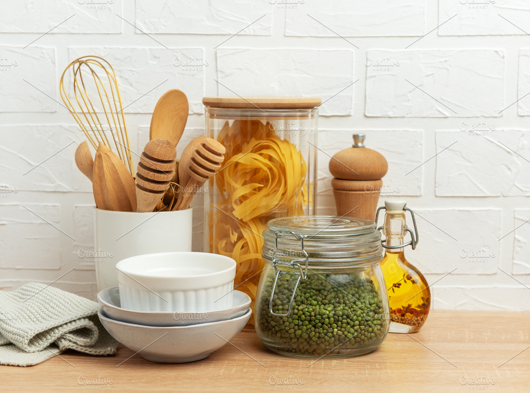 Kitchen utensils, pasta, mung beans, and oil creating a cozy cul, a Food & Drink Photo by Olena Rudo