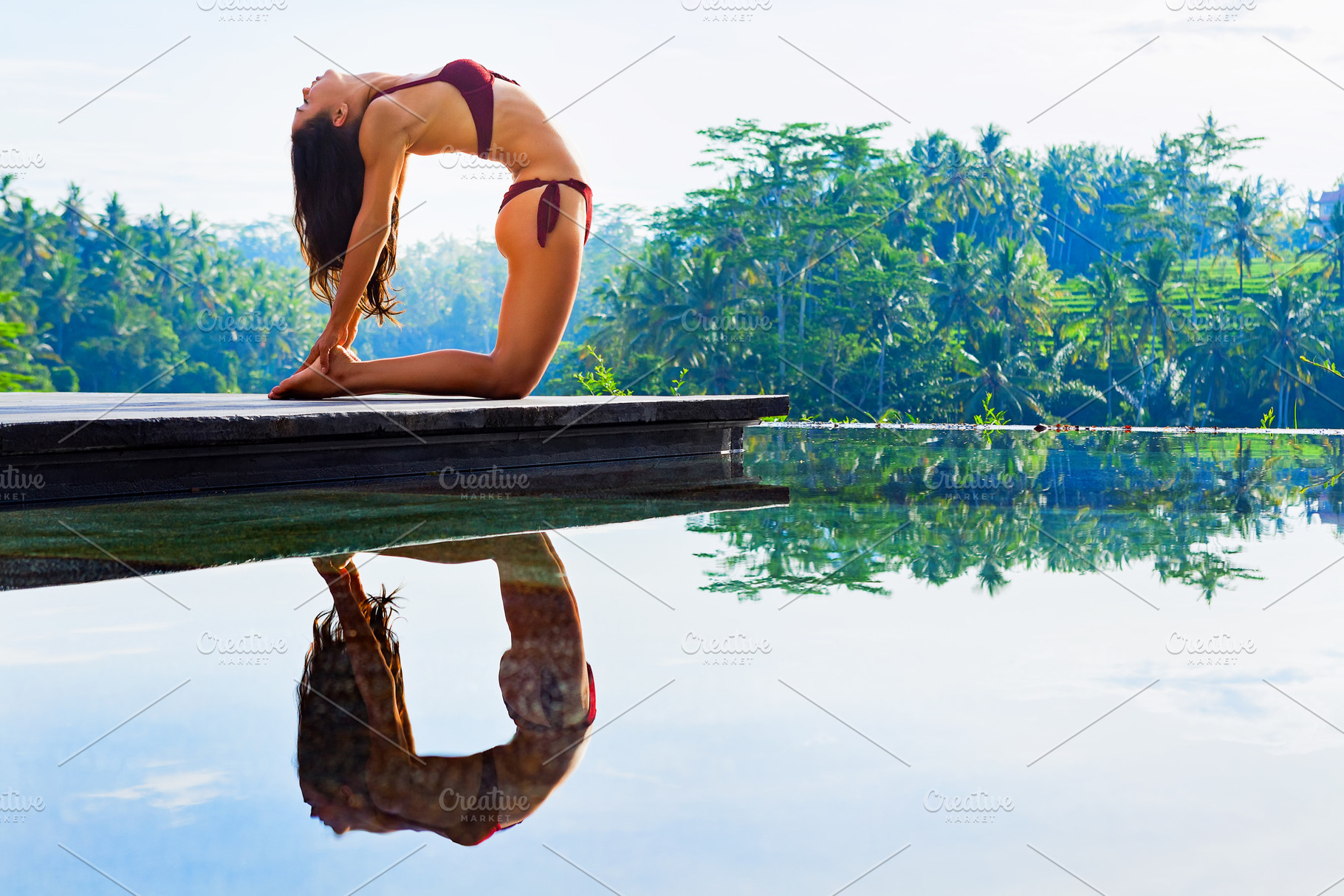 Young yoga woman stretching back, a Person Photo by Tropical Studio