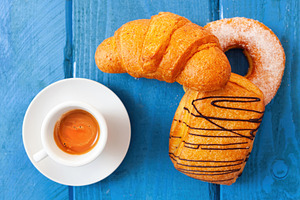 Delicious italian breakfast with espresso coffee, croissant, donut and saccotti, a Food & Drink Photo by Antonio Gravante Market