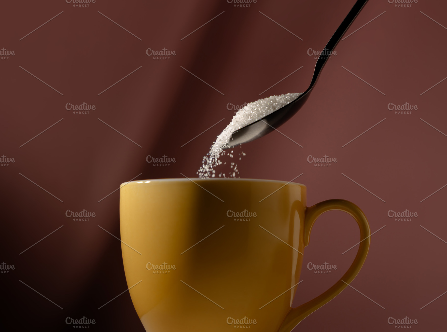 Spoon pouring sugar into a cup of drink. Concept of unhealthy di, a Photo by salmon.black