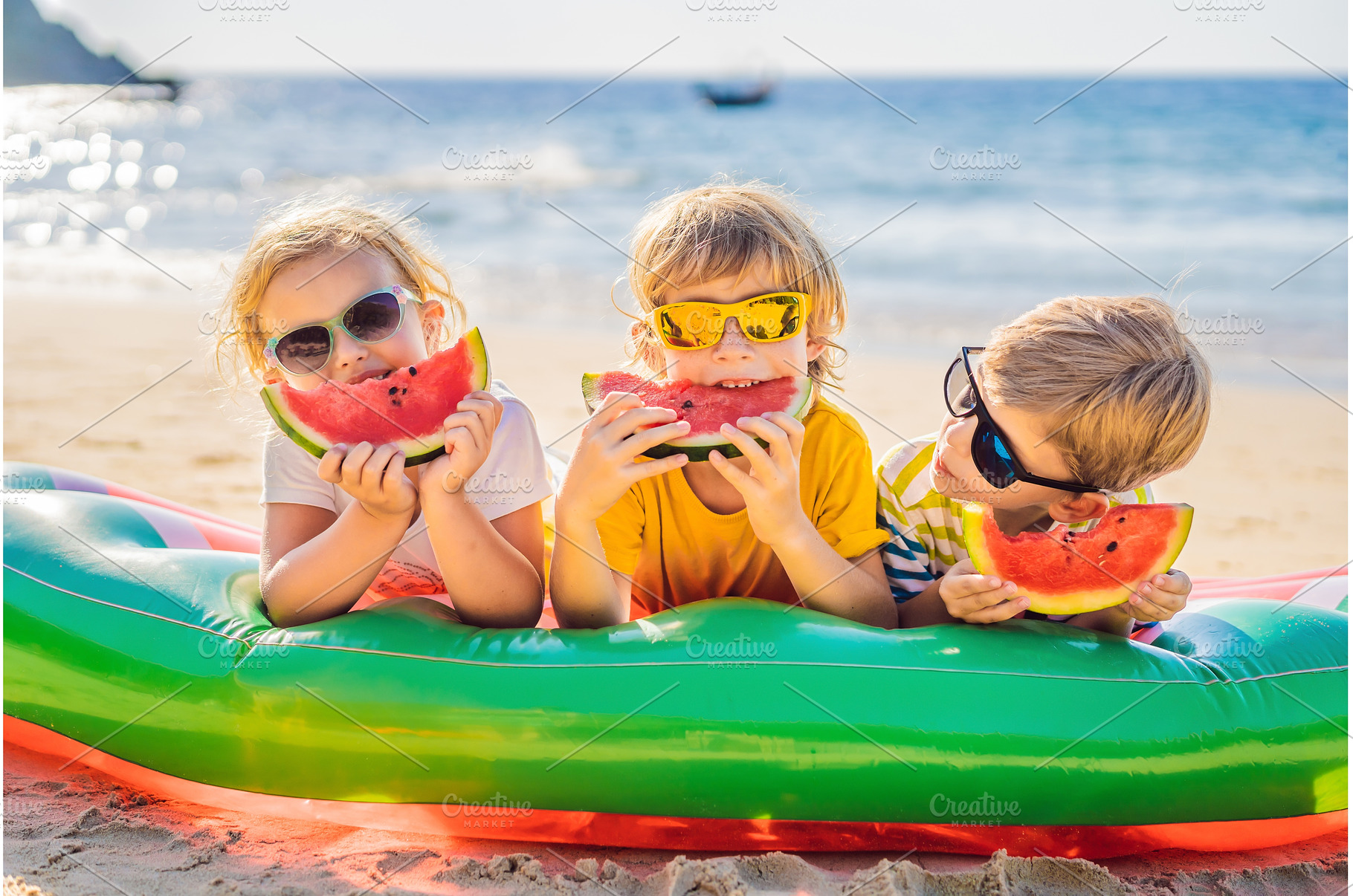 Children eat watermelon on the beach, a Sports & Recreation Photo by Elizaveta Galitskaya