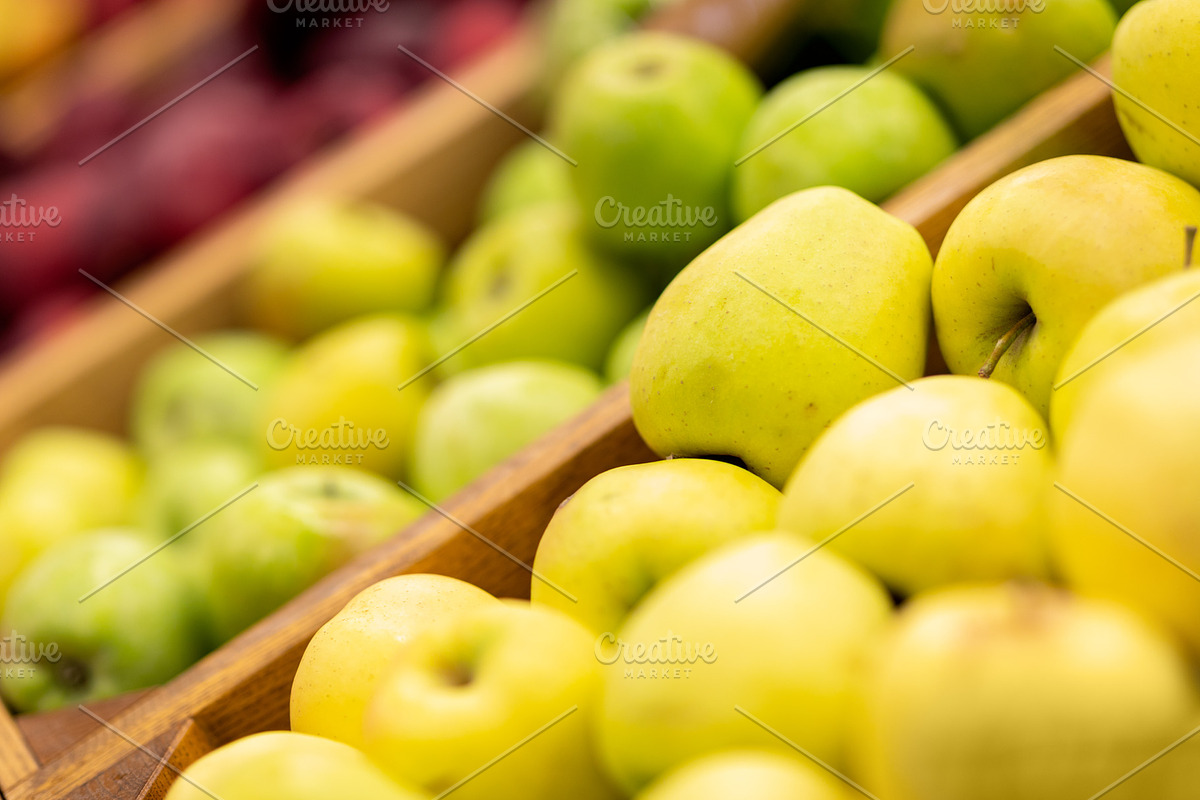 Showcase with various types of apples at supermarket, a Photo by Prostock-Studio (Photo 1 of 2)