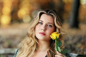 Beautiful blonde woman holding a yellow rose, portrait in nature, a Person Photo by Studio ANNA