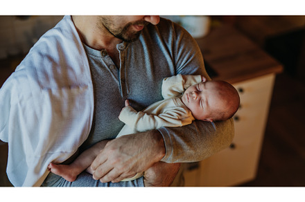 Close-up of father holding his, a Person Photo by HalfPoint