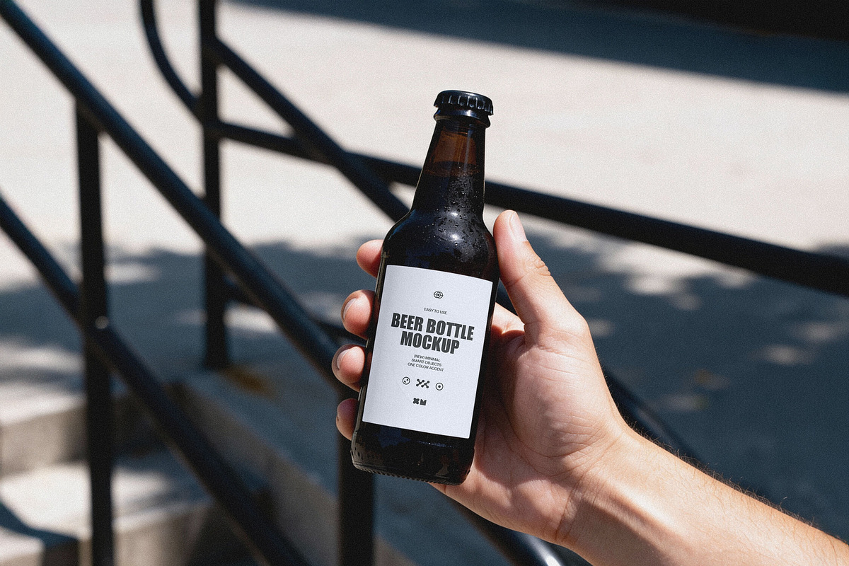 Amber Beer Bottle in Hand Mockup, a Product Mockup by Design Squad (Photo 2 of 4)