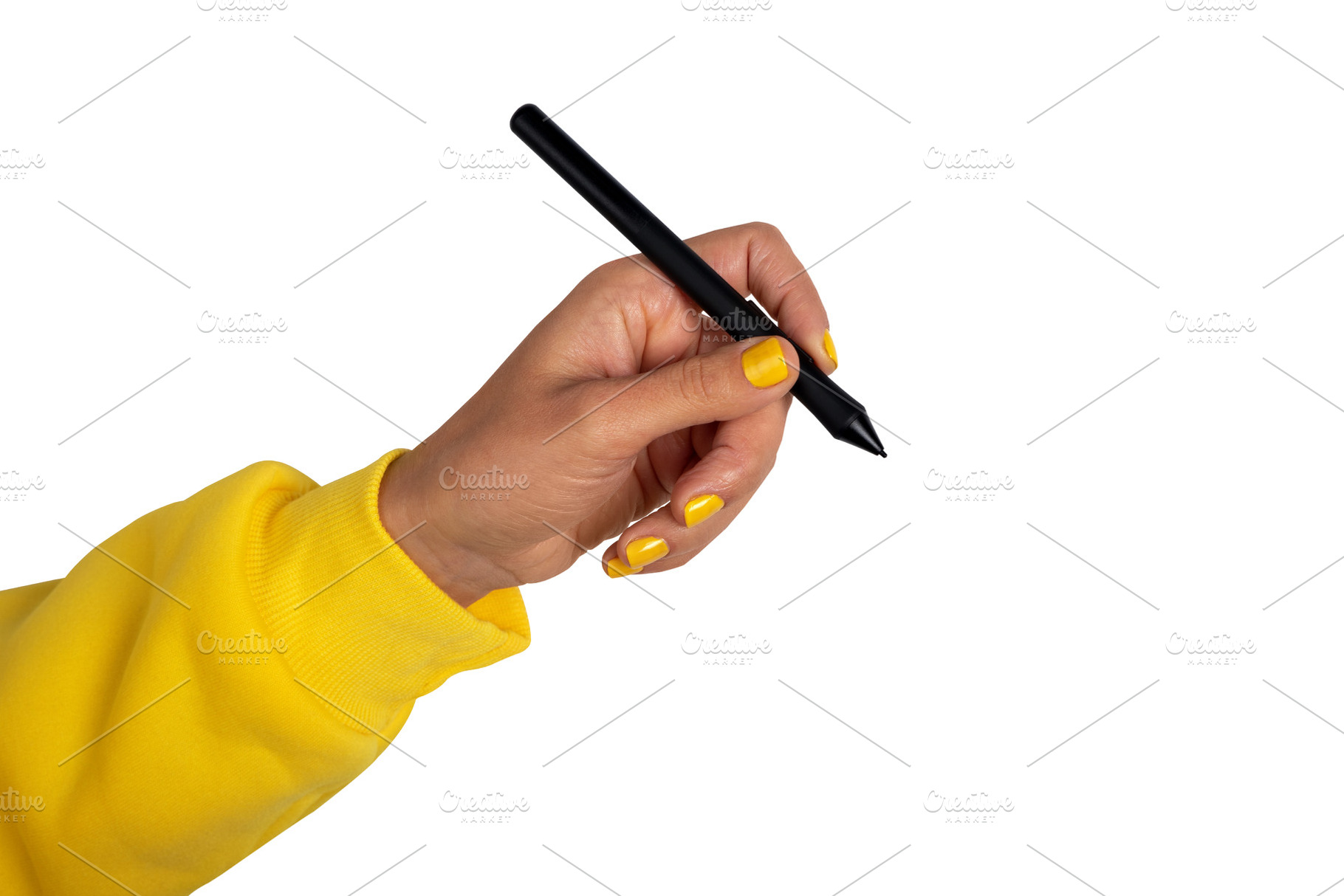 Close-up of a hand in a yellow sleeve holding a black stylus pen, a Technology Photo by Ales Munt