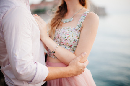 Couple hug on seaside stock photo containing back and beach, a Person Photo by Olyryk & Aglo
