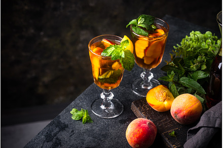 Cold ice tea with peach and mint, a Food & Drink Photo by Yulia Furman