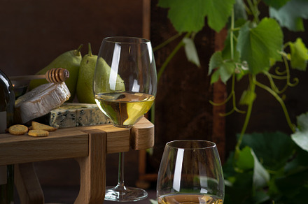 White wine in glasses, pear, cheese, a Food & Drink Photo by nafood
