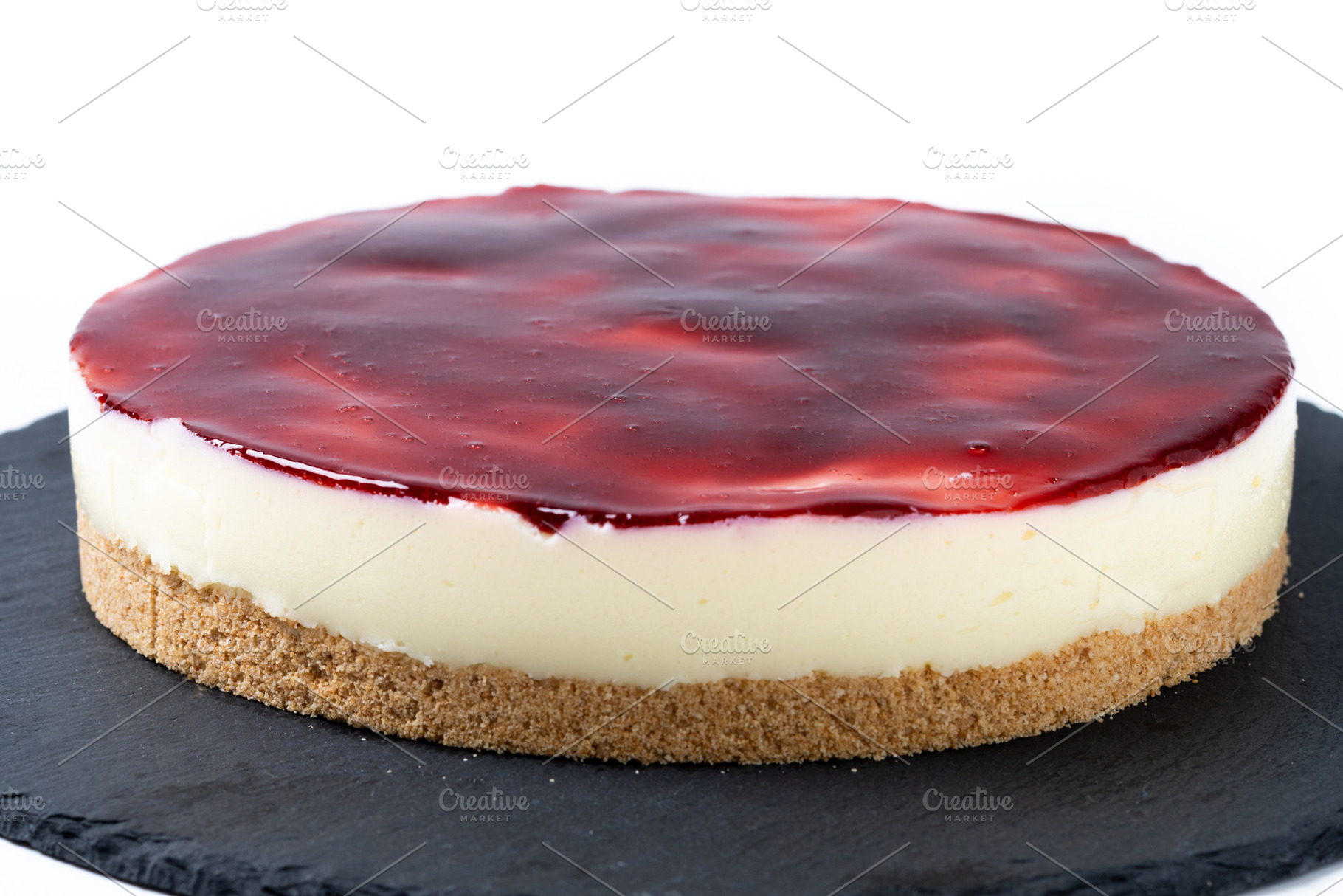Slice of cheesecake with strawberries isolated on white background, a Food & Drink Photo by etorres69
