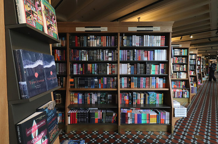 Row of racks with books. Bookshop shelves showcases., a School & Education Photo by Textures & Backgrounds
