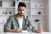 Young Arab Man Checking Blood Pressure With Modern Tonometer At Home, a Photo by Prostock-Studio (Thumbnail 2 of 2)