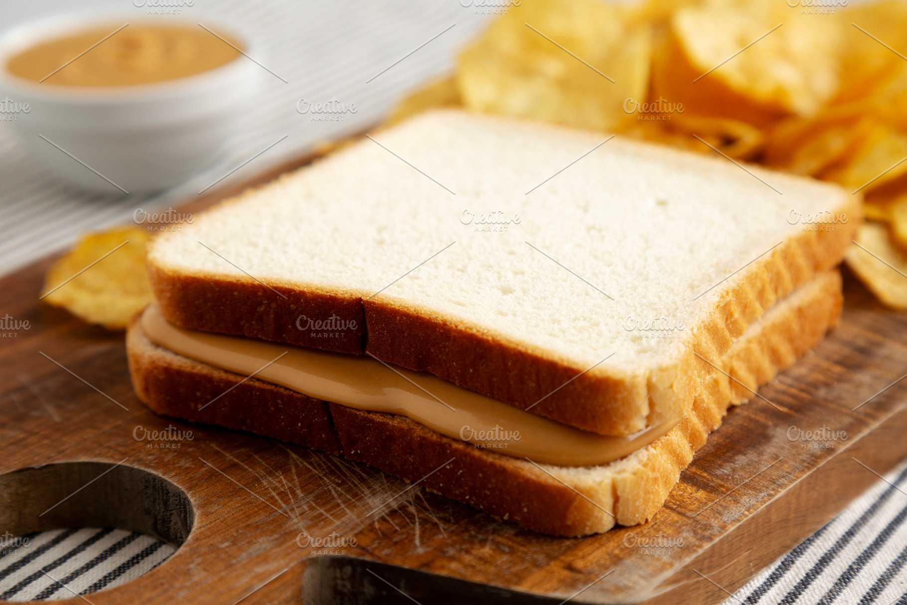 Homemade American Peanut Butter Sandwich on a Wooden Board, side, a Food & Drink Photo by LiudmylaChuhunova