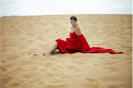 sexy brunette woman in a red long, a Person Photo by SaulichPhoto