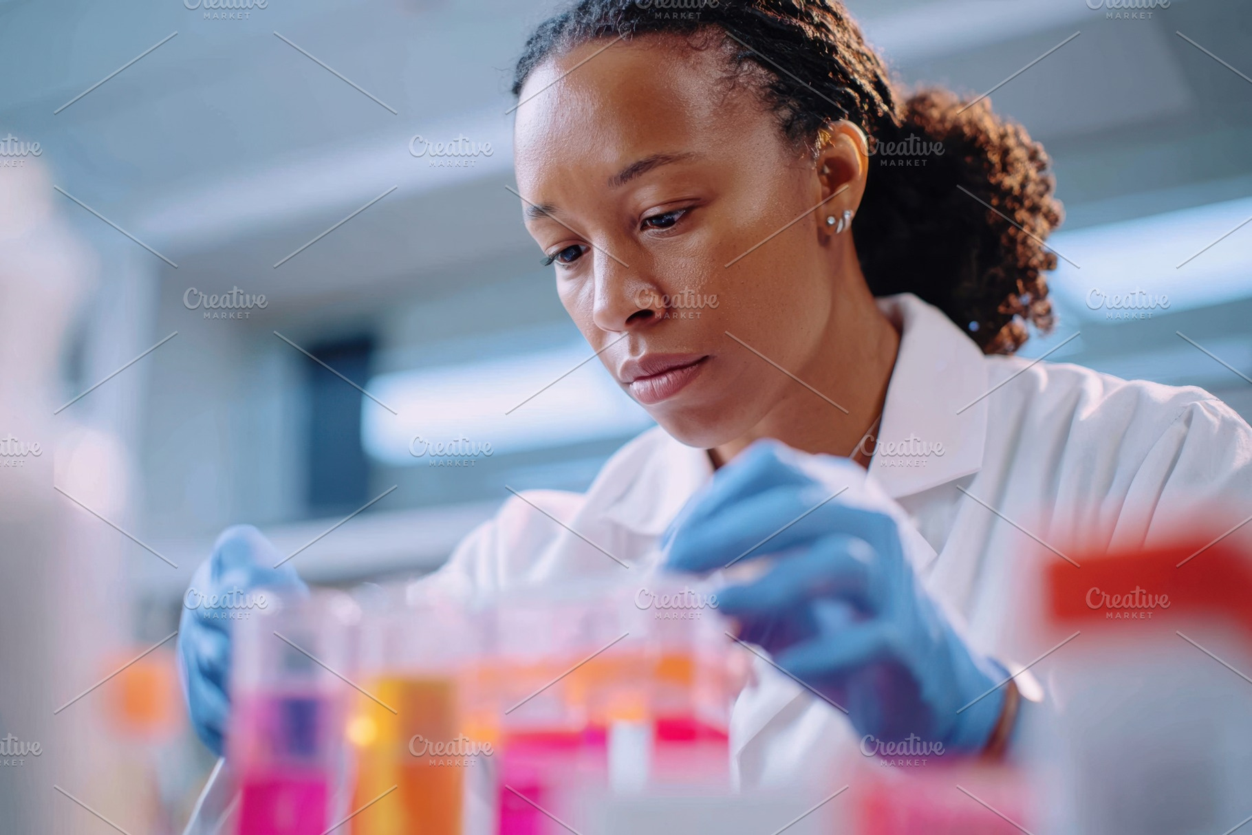 Scientist examining test tube in laboratory, a Health & Medical Photo by AlyaAnd