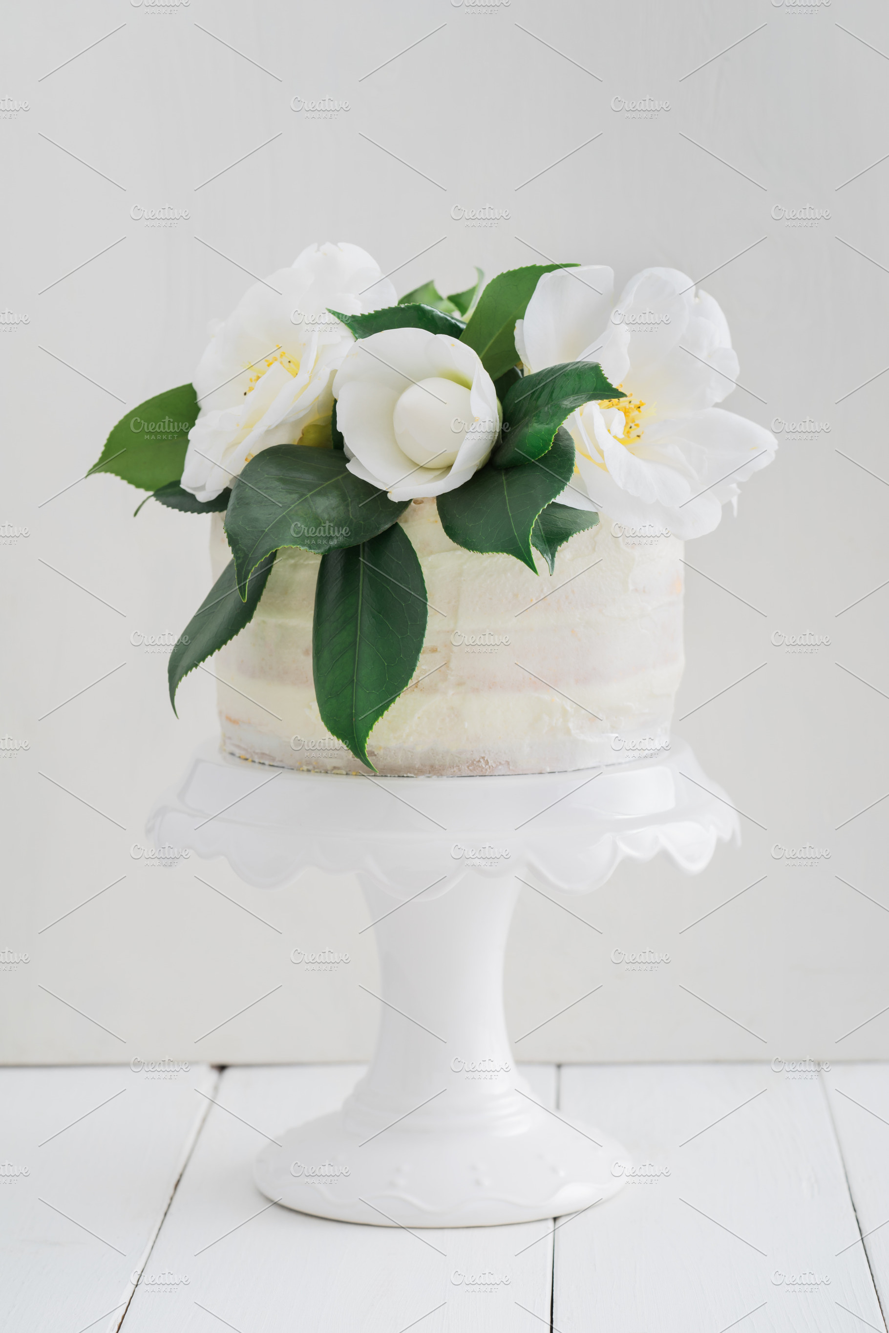Naked wedding cake with camellias stock photo containing wedding cake and, a Food & Drink Photo by Elisabeth Cölfen