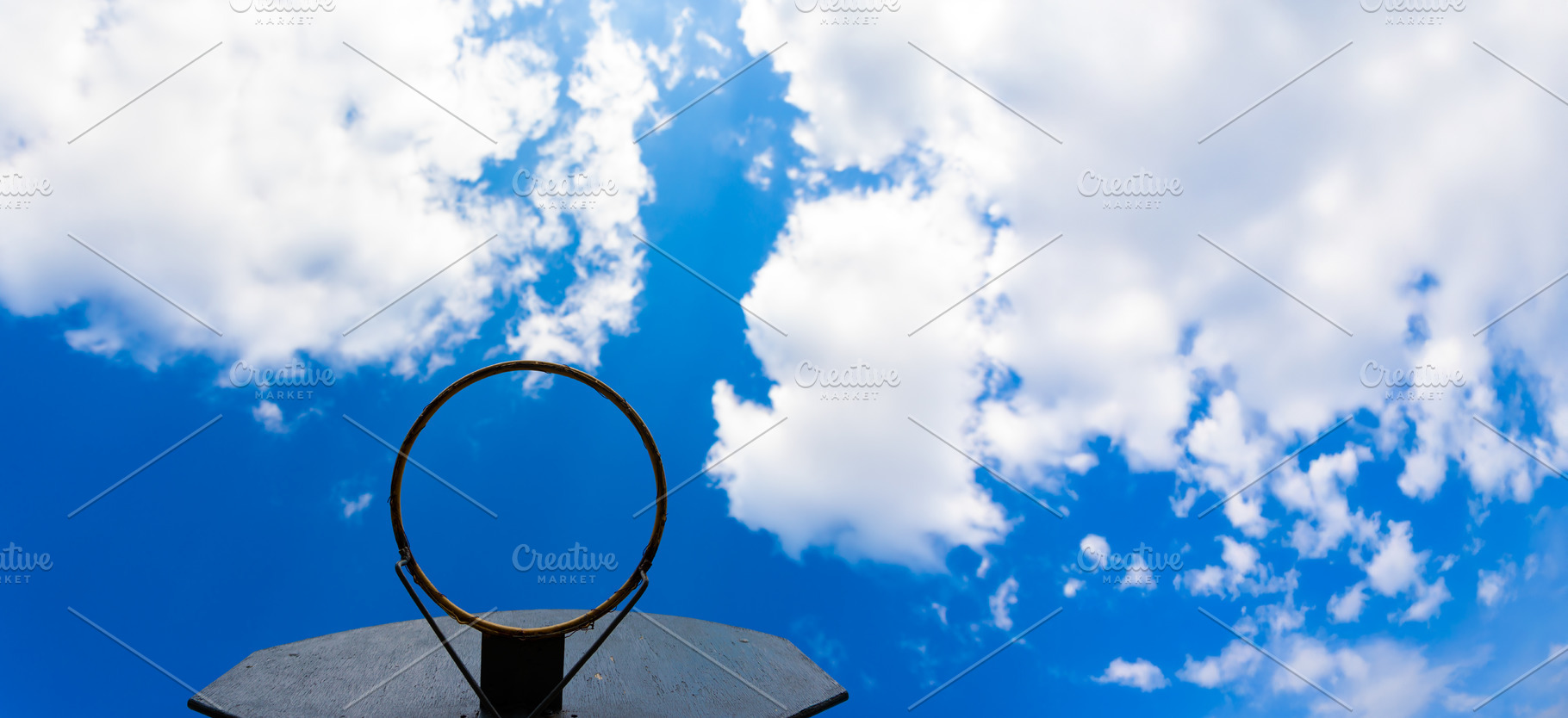 Low angle view of a weathered basketball hoop with no net, frame, a Sports & Recreation Photo by Ales Munt