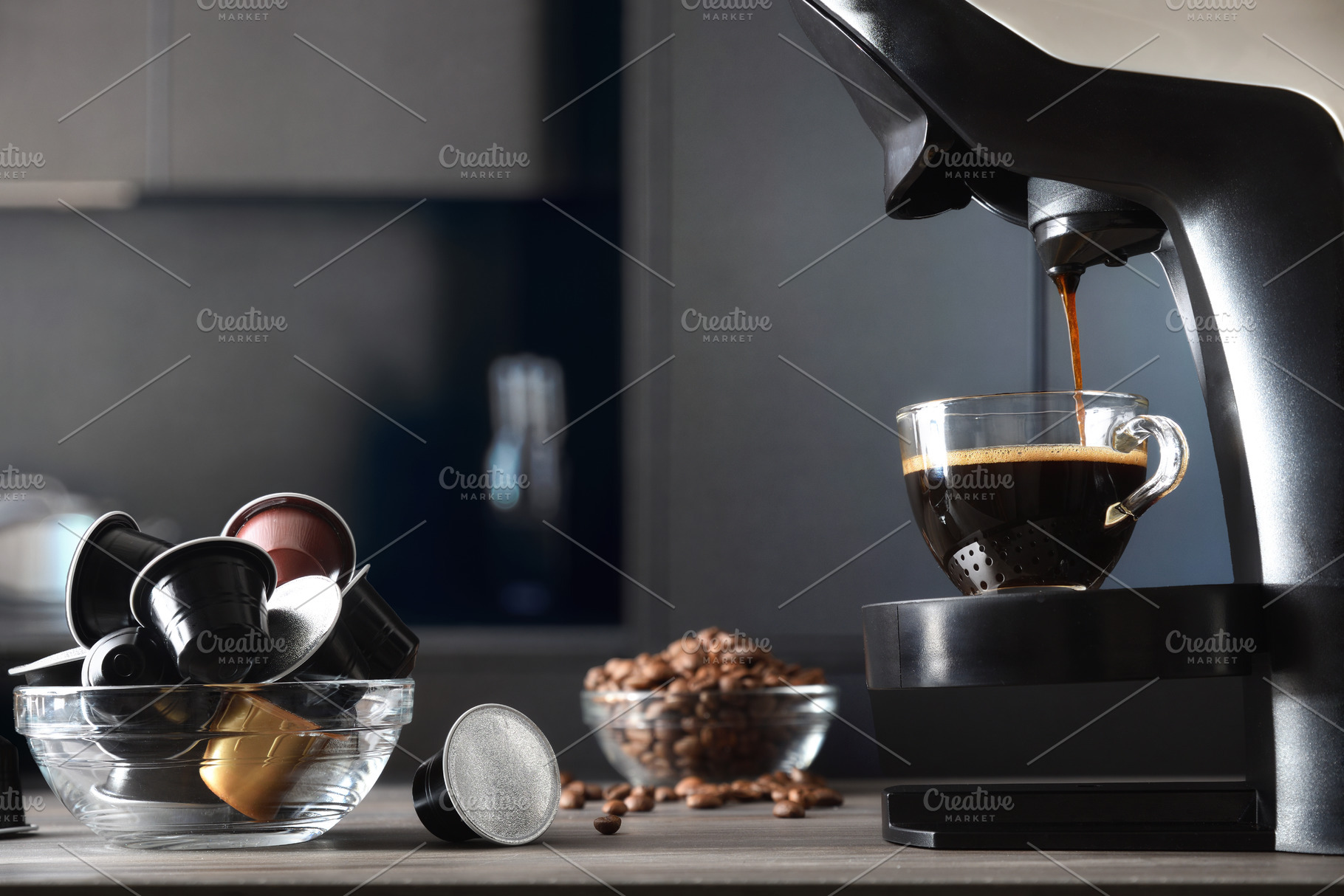 Capsule coffee machine preparing espresso in a dark kitchen, a Food & Drink Photo by Davizro's Market
