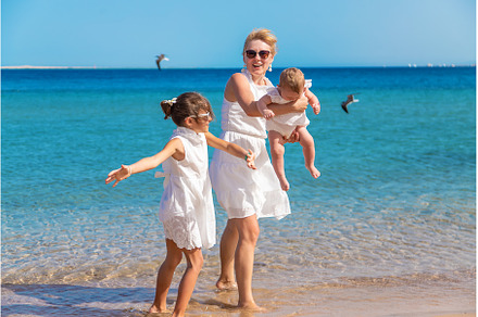 Mother with her daughters at sea, a Person Photo by yanadjana