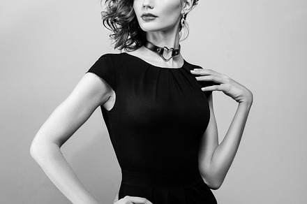 Beautiful woman with red hair in a black dress featuring fashion, model, and, a Beauty & Fashion Photo by sport&beauty stock photo