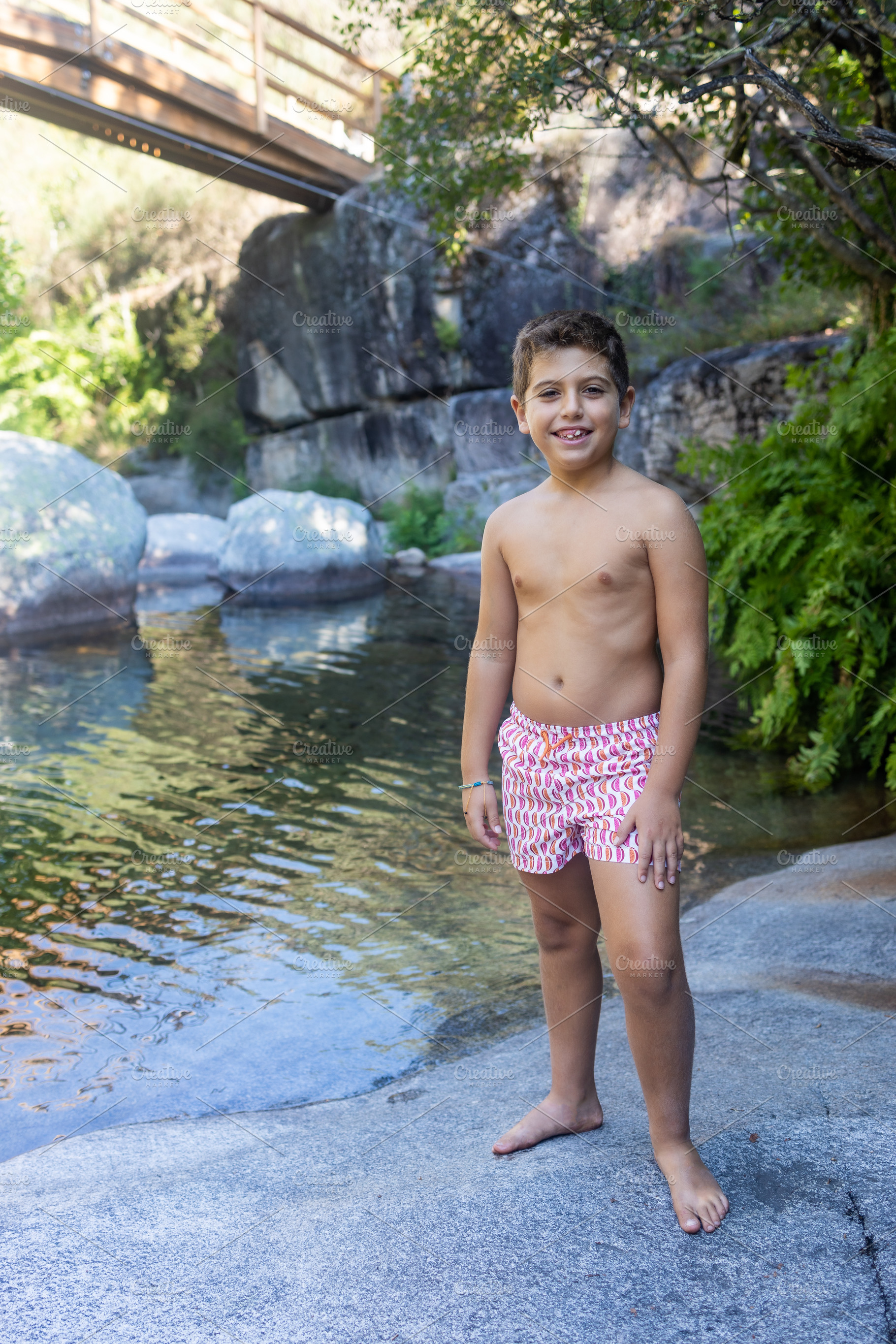 Little boy near of a river at summer, a Person Photo by Cosca