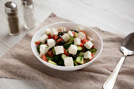 Homemade Shepards salad with cucumbers, parsley and feta in a wh, a Food & Drink Photo by LiudmylaChuhunova