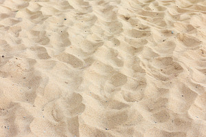 Close-up of smooth, golden sand with gentle ripples, perfect for backgrounds, t, a Background Photo by Ales Munt
