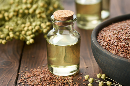Linseed oil bottle and flax seeds, a Food & Drink Photo by chamillewhite