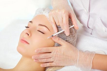 A woman receives an inejection on her face stock photo containing botox and, a Health & Medical Photo by StudioRomantic