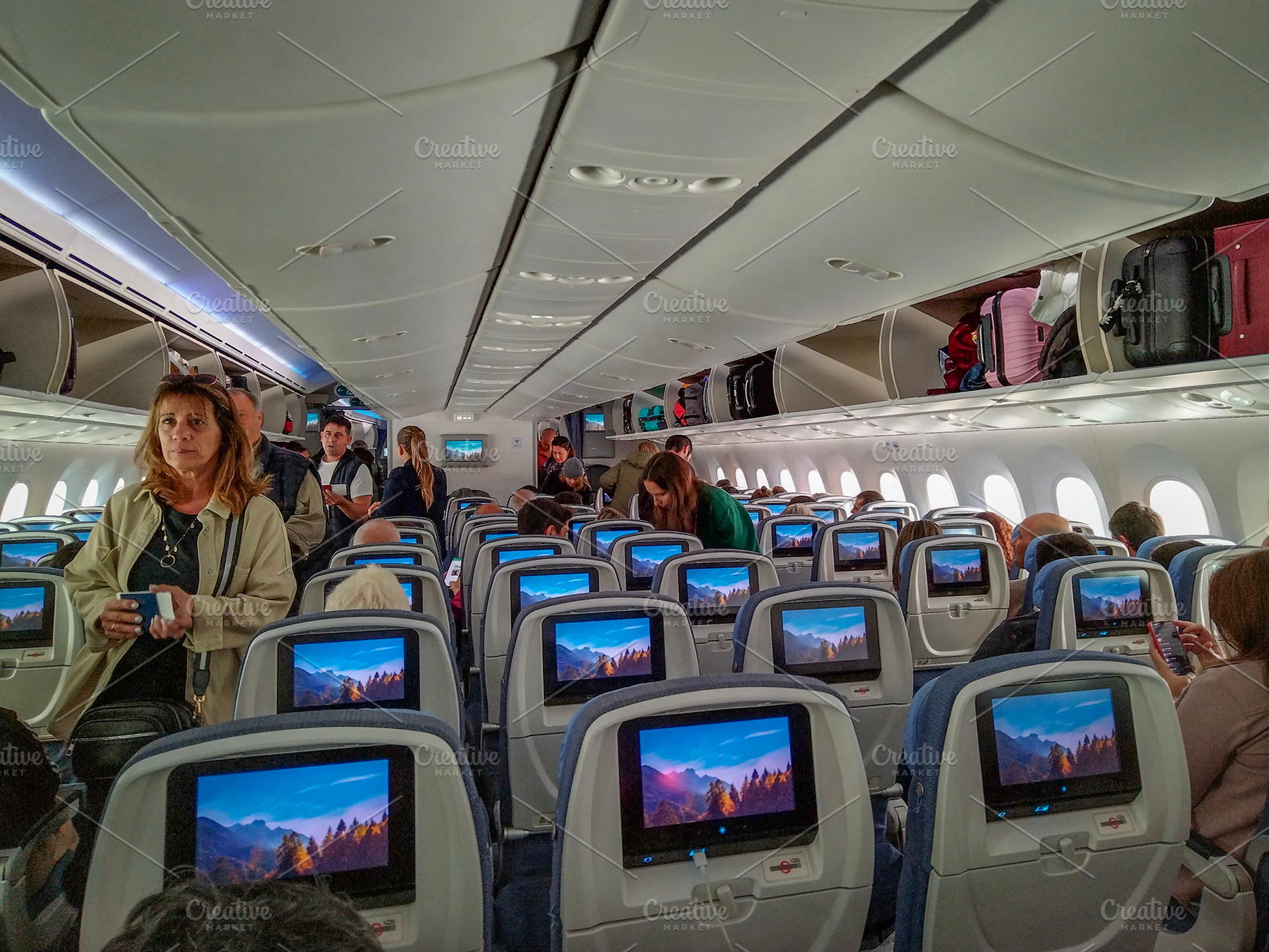 Interior of airplane cabin with before flying, a Transportation Photo by DanFLCreativo