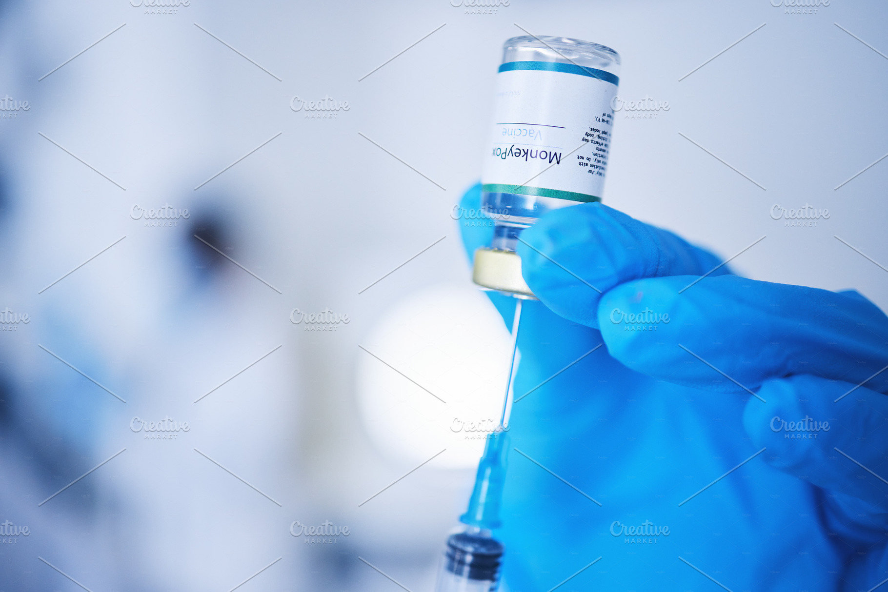 Injection vial, doctor and monkeypox vaccine of safety, healthcare medicine or pharmaceutical laboratory test. Closeup needle, hands and liquid bottle of virus risk, wellness or medical science drugs, a Photo by Peopleimages.com